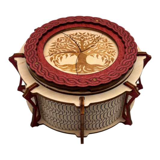 Boîte  ronde à mécanisme en bois, avec système d'ouverture ingénieux pour les esprits curieux. boite à bijoux, boite secrète.
De fabrication française et artisanale 